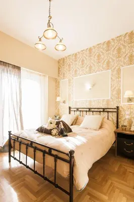 a bedroom with a large bed in a room at A Modern Antique Central 3 Bedroom Simple Apartment near to Acropolis in Athens