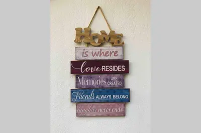 a sign that reads love is where love resides at Modern hospitality, with private garden, Athens in Athens