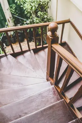 a set of wooden stairs with a wooden railing at Neoclassical Apartment near Acropolis - LivingStone Crystal in Athens