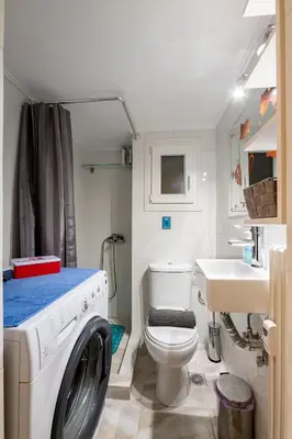 a bathroom with a washing machine and a sink at Beautiful studio at Panathenaic Stadium in Athens