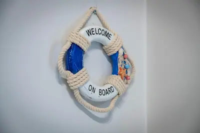 a welcome on board wreath hanging on a wall at Beautiful studio at Panathenaic Stadium in Athens