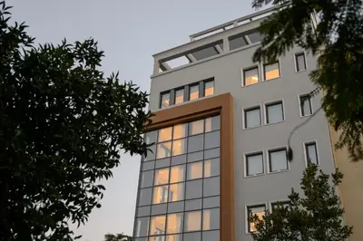 an office building with its lights on at The Convo Syngrou Apartments in Athens