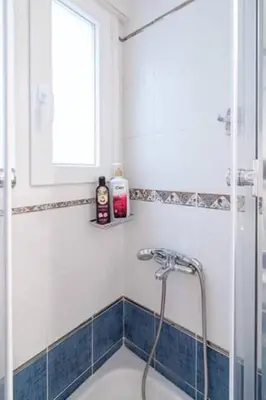 a bathroom with a shower and a tub at Studio in the city center, Syntagma in Athens