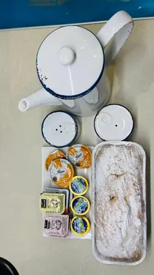 a bunch of different types of food on a table at Cozy apartment ideally located city center and Megaron Moussikis metro station in Athens