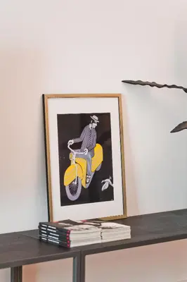 a picture of a man riding a yellow motor scooter at BAG- Boutique Apartment Grey - Hilton Area in Athens