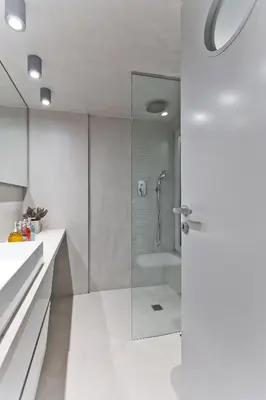 a bathroom with a shower and a glass door at BAG- Boutique Apartment Grey - Hilton Area in Athens