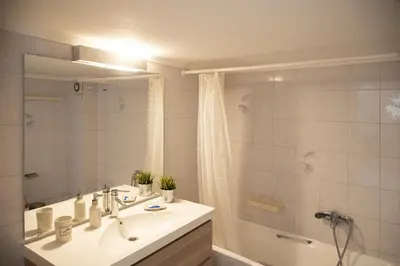 a bathroom with a sink and a shower at Central Halandri apartment near all hospitals in Athens