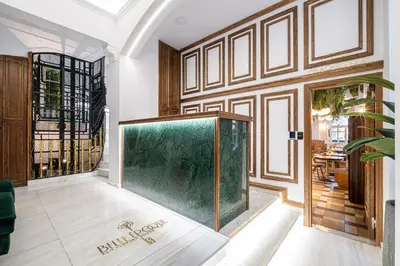 a large aquarium in the middle of a room at Belle Epoque Suites in Athens
