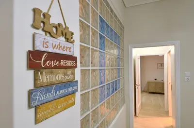 a hallway with signs on the wall at Plaka, Apartment in the old historical neighborhood of Athens in Athens