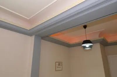 a coffered ceiling with a light fixture in a room at Plaka, Apartment in the old historical neighborhood of Athens in Athens