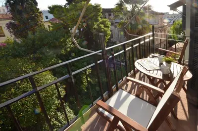 a balcony with a table and bench on a railing at Plaka, Apartment in the old historical neighborhood of Athens in Athens