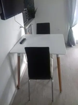 a white table with two chairs and a keyboard at Agia Paraskevi, a cozy and minimal retire in Athens