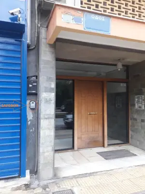 a front door of a building with a sign on it at Kerameikos, a lovely apartment in Athens