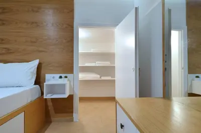 a bedroom with a bed and a desk with a mirror at Acropolis, a nice and minimal apartment in Athens