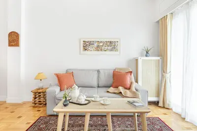 a living room with a couch and a coffee table at Chill Out In Retropolitan Hideaway at Alsos Park in Athens