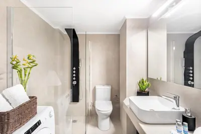 a bathroom with a toilet and a sink at Stylish, 3-brdm Family Apartment near Acropolis! in Athens