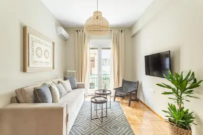 a living room with a couch and a tv at Discover Athens from Urban Hideaway, Acropolis View in Athens