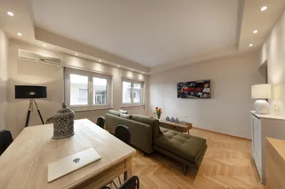 a living room with a couch and a table at Kolonaki 2 Bdr apartment in Athens