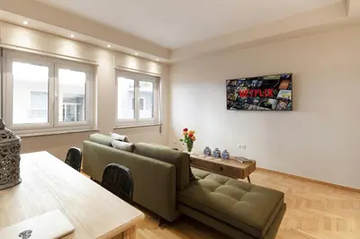 a living room with a couch and a table at Kolonaki 2 Bdr apartment in Athens