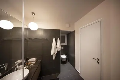 a bathroom with a sink and a toilet at Kolonaki 2 Bdr apartment in Athens