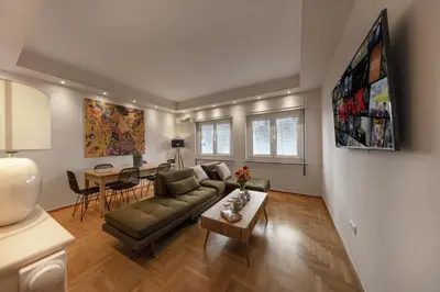 a living room with a couch and a table at Kolonaki 2 Bdr apartment in Athens
