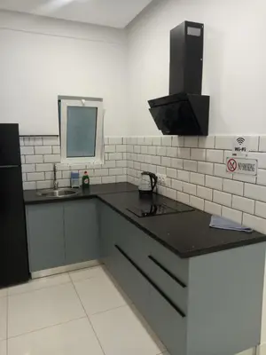 a kitchen with a black counter top and a sink at SOFOKLEOUS 57, STUDIO KATERINA IN KALLITHEA. in Athens