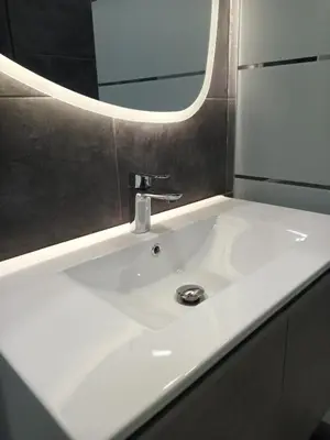a white sink in a bathroom with a mirror at SOFOKLEOUS 57, STUDIO KATERINA IN KALLITHEA. in Athens