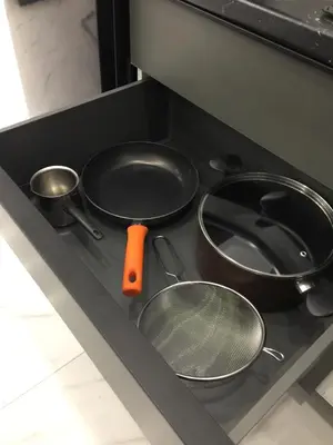 a stove with three pots and pans on it at SOFOKLEOUS 57, STUDIO KATERINA IN KALLITHEA. in Athens