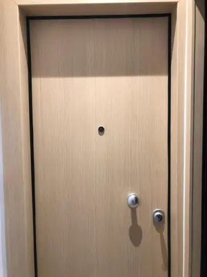 a close up of a wooden door of a cabinet at Metropolitan Complex Suite Faliro in Piraeus