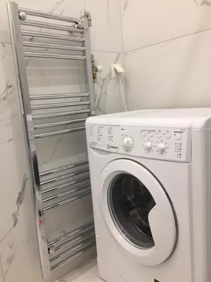 a washer and dryer in a bathroom with a washing machine at Patision Avenue, Apartment with Two bedrooms in Athens