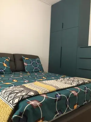a bedroom with a bed with a blue cabinet at Patision Avenue, Apartment with Two bedrooms in Athens
