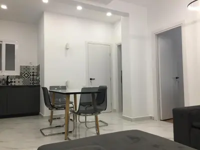 a dining room with a table and chairs at Patision Avenue, Apartment with Two bedrooms in Athens