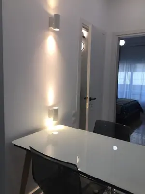 a white table with two chairs in a room at Patision Avenue, Apartment with Two bedrooms in Athens