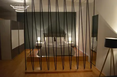 a room with a bed and black bars at Cinema Zeus Studios - by Avelink in Spáta