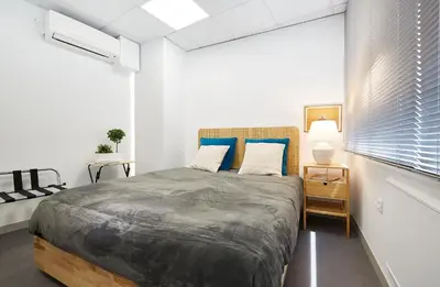 a bedroom with a large bed and a window at Chloe Boutique Apartments Apollo in Athens