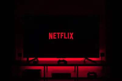 a television with a netflix sign on top of it at Faliro Apartments Next To The Beach in Athens