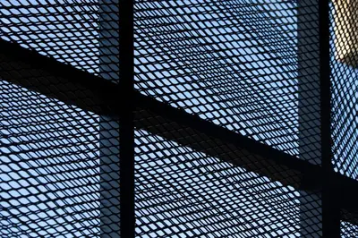 a close up of a metal lattice fence at Thisean Modern Suites By Athens Stay in Athens