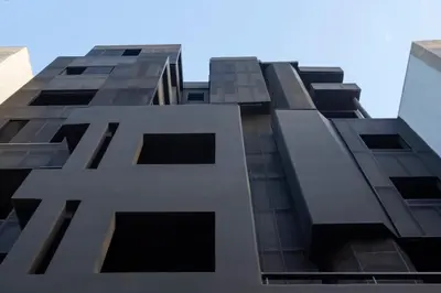 a tall building looking up at the sky at Thisean Modern Suites By Athens Stay in Athens