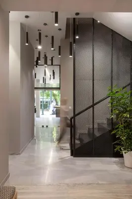 a hallway with a glass door with a potted plant at Thisean Modern Suites By Athens Stay in Athens
