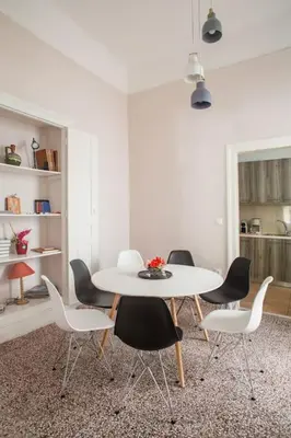 a dining room with a white table and chairs at Splendid Full 5BDR/3bath/2kitchens Mansion in ATH in Athens