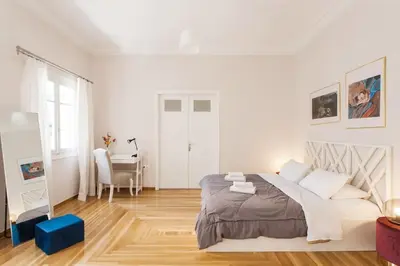 a white bedroom with a bed and a desk at Splendid Full 5BDR/3bath/2kitchens Mansion in ATH in Athens