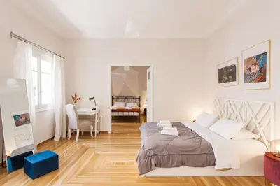 a white bedroom with a bed and a desk at Splendid Full 5BDR/3bath/2kitchens Mansion in ATH in Athens