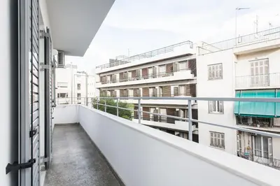 an apartment balcony with white buildings at HIGHEND 2BDR Full APT/ IDEAL LOCATION (and Netflix) in Athens