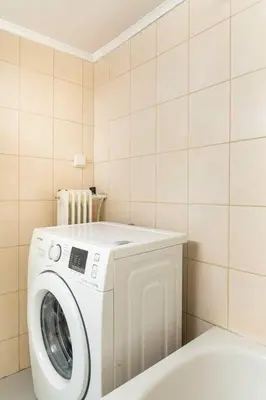 a white washer and dryer in a bathroom at OpenAir HOT TUB/Big Balcony/Great Boutique Apt in Athens