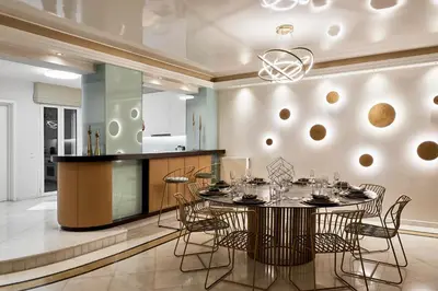 a dining room with a table and chairs and a kitchen at Grystal Green Properites in Athens