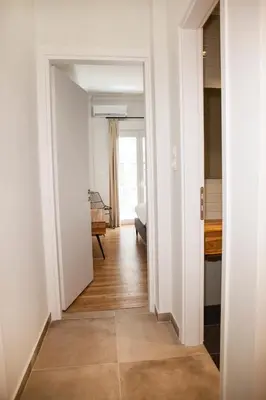 a hallway with a door leading into a room at Central Comfy Modern Flat 2 bedrooms 2 bathrooms in Athens