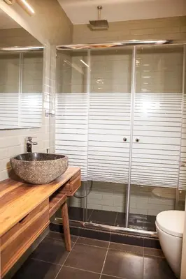 a bathroom with a sink and a shower at Central Comfy Modern Flat 2 bedrooms 2 bathrooms in Athens