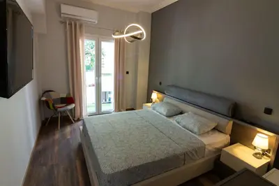 a bedroom with a bed with two pillows on it at Double Romantic Suite in Athens