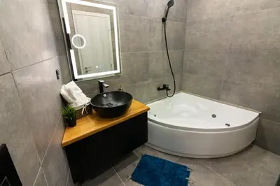 a bathroom with a sink and a bath tub at Double Romantic Suite in Athens