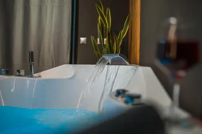 a bathroom sink with water coming out of it at NOHO Boutique , premium living Lazeon 7 in Athens